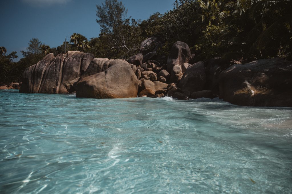 Romantic couple walking on tropical beach Seychelles Mahé