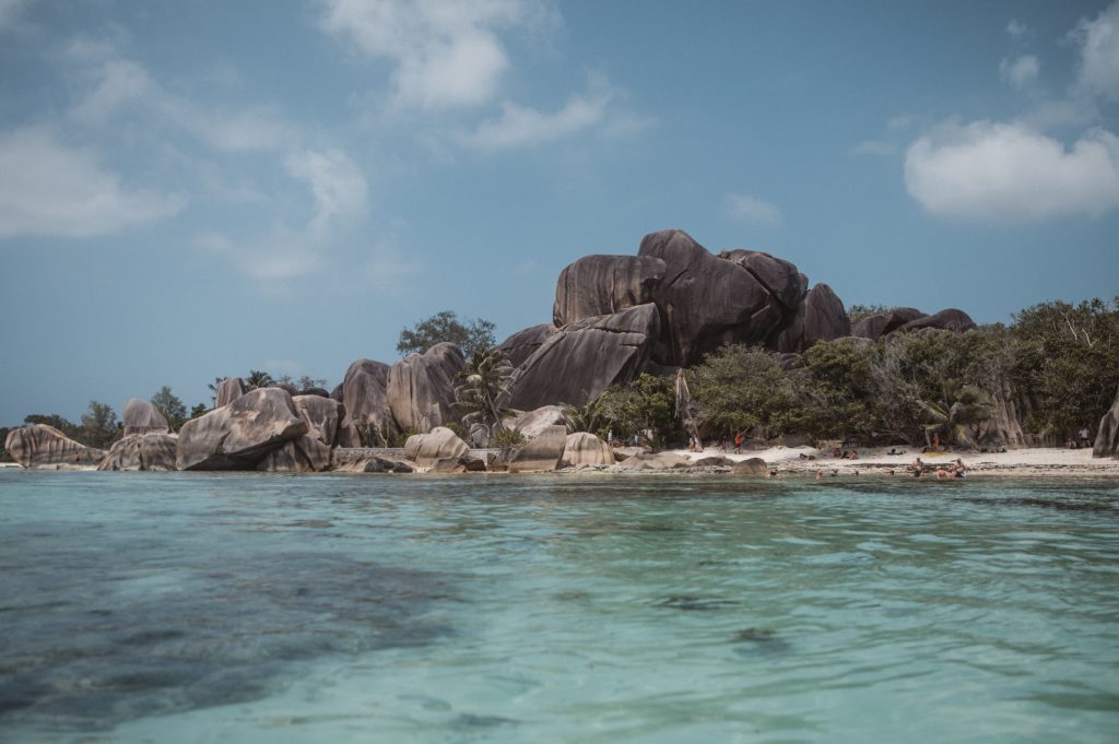 Romantic couple walking on tropical beach Seychelles Mahé